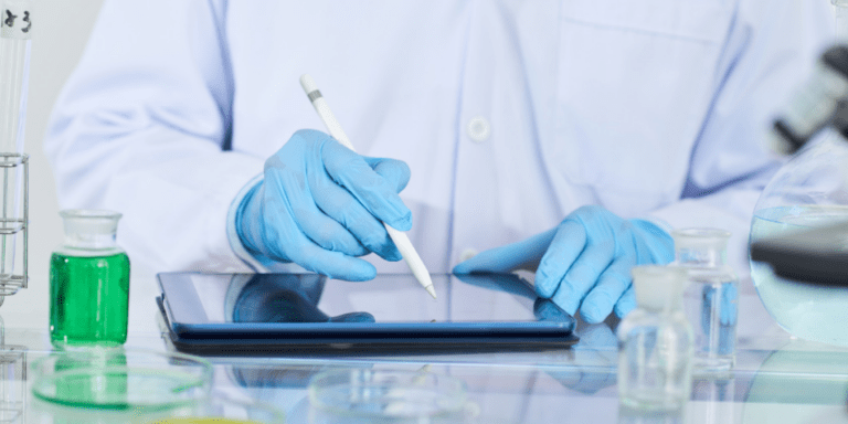 A researcher uses digital tools to capture study information.