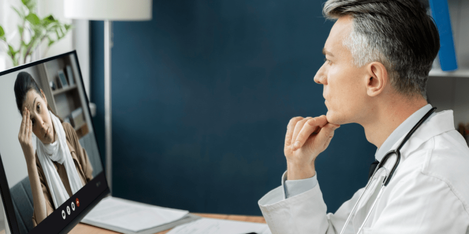 Doctor talking to a patient online.